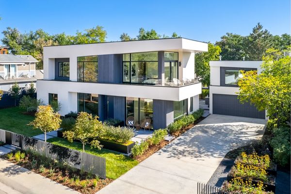Aerial shot of modern two story house with gray accents on a sunny day